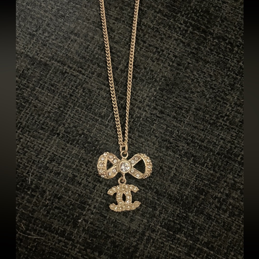 Chanel CC Drop Bow Necklace, gold with rhinestone details.